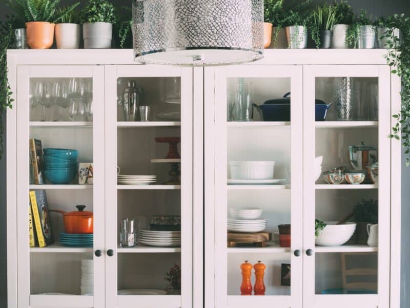 White-painted display cabinet with glass doors