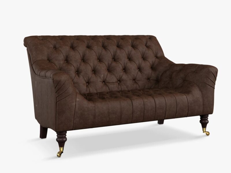 Leather upholstered sofa with button back deatiling