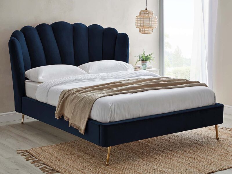 Dark blue fabric bed with large headboard