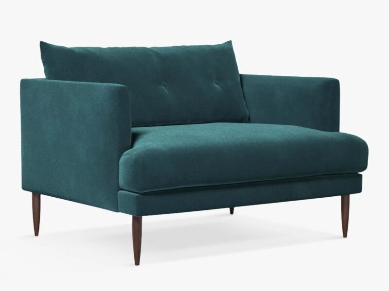 Button back love seat with green velvet upholstery