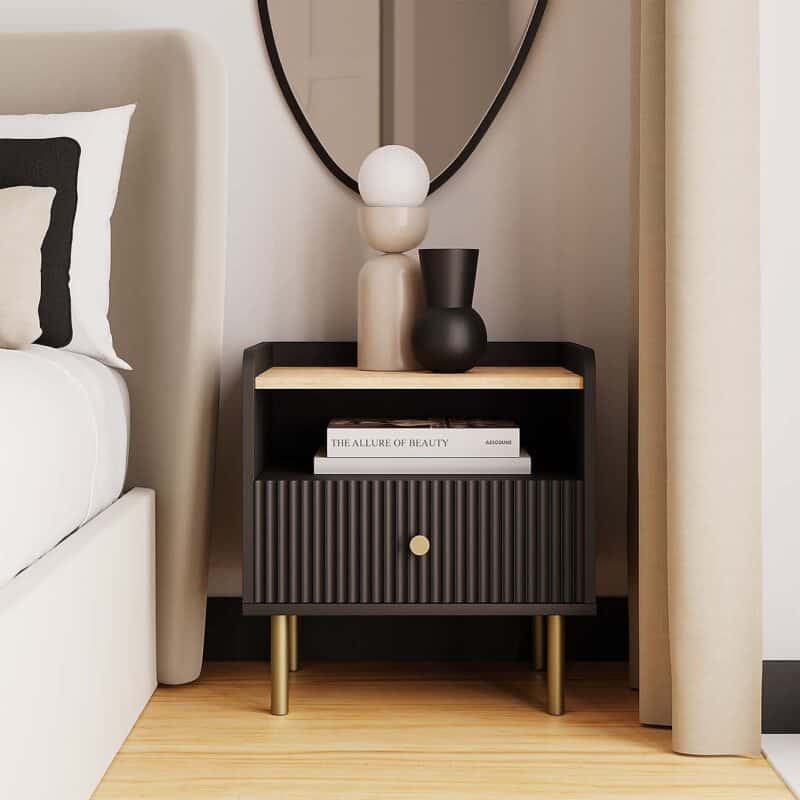 Black bedside with ribbed fron and gold colour legs