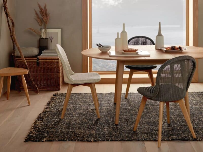 Woven rattan side chairs with oak legs