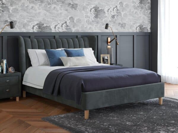 Grey velvet bed frame with large panelled headboard