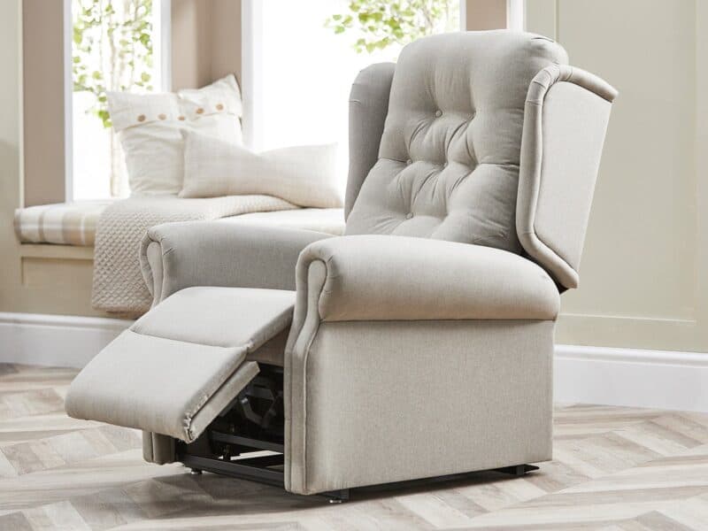 Button back reclining armchair