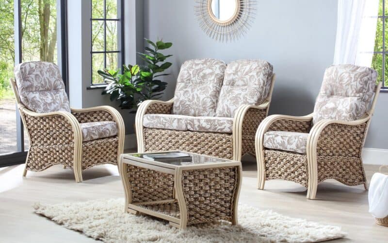 Cane and rattan furniture with floral print cushions