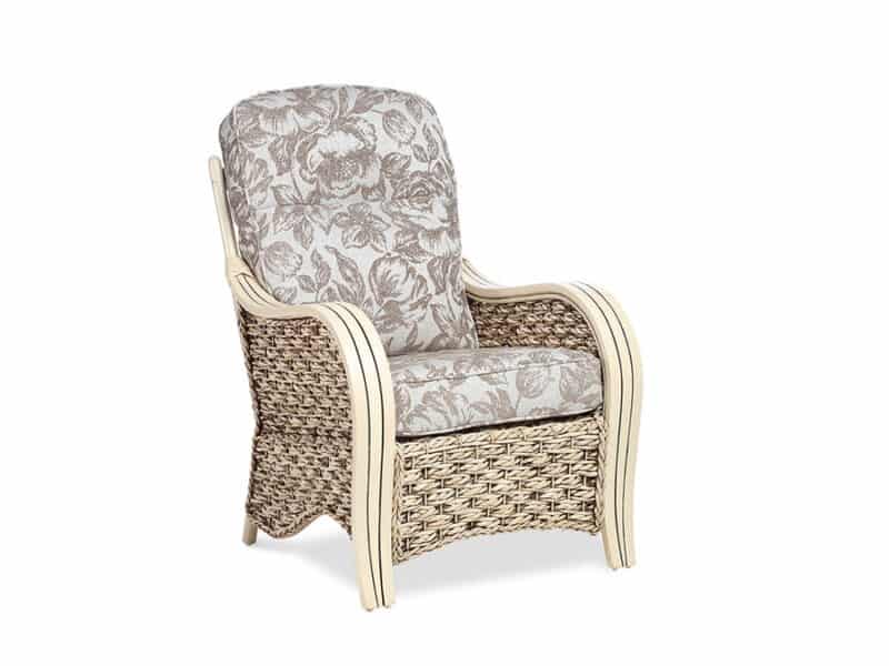 Cane and rattan armchair with floral fabric cushions