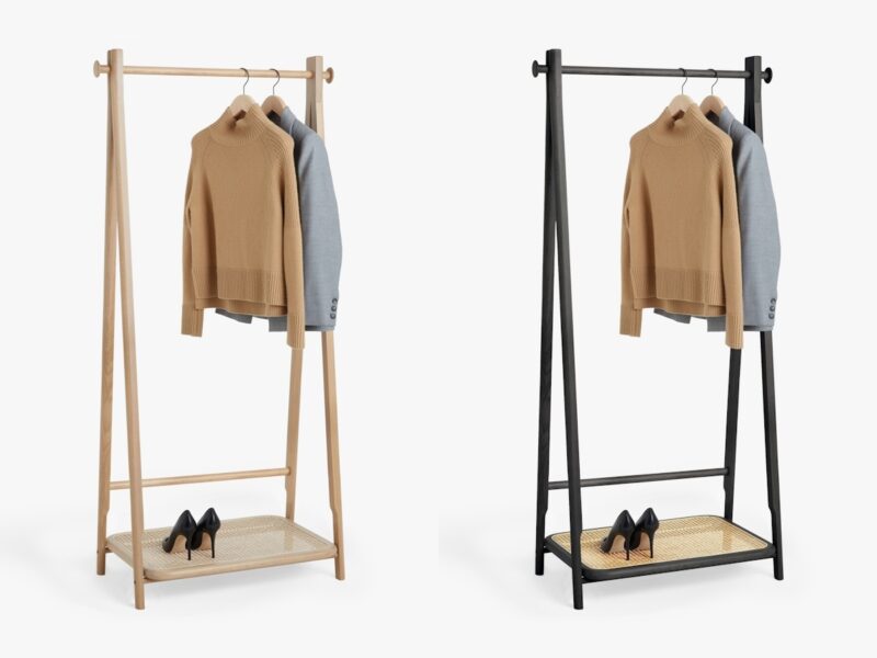 Oak and black clothes rail with a woven rattan shoe shelf