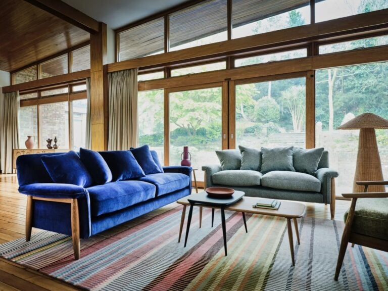 Mid-century style sofas with exposed wooden frames