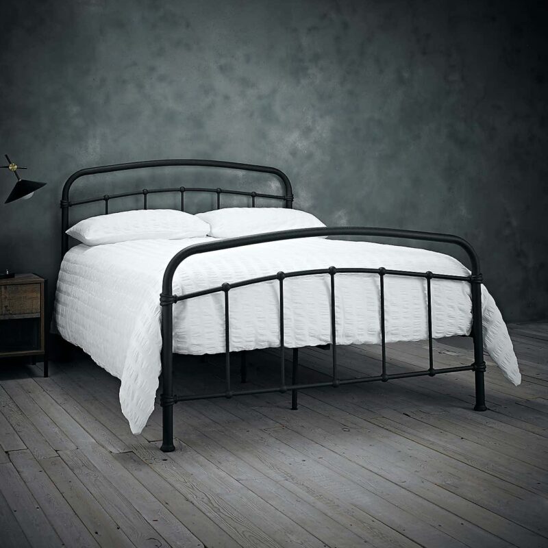 Metal double bed frame with a black-painted finish