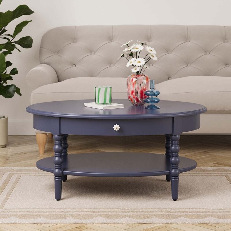 Round navy coffee table with turned legs