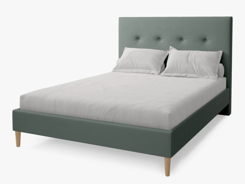 Green fabric upholstered bed frame with buttoned head board and wooden legs