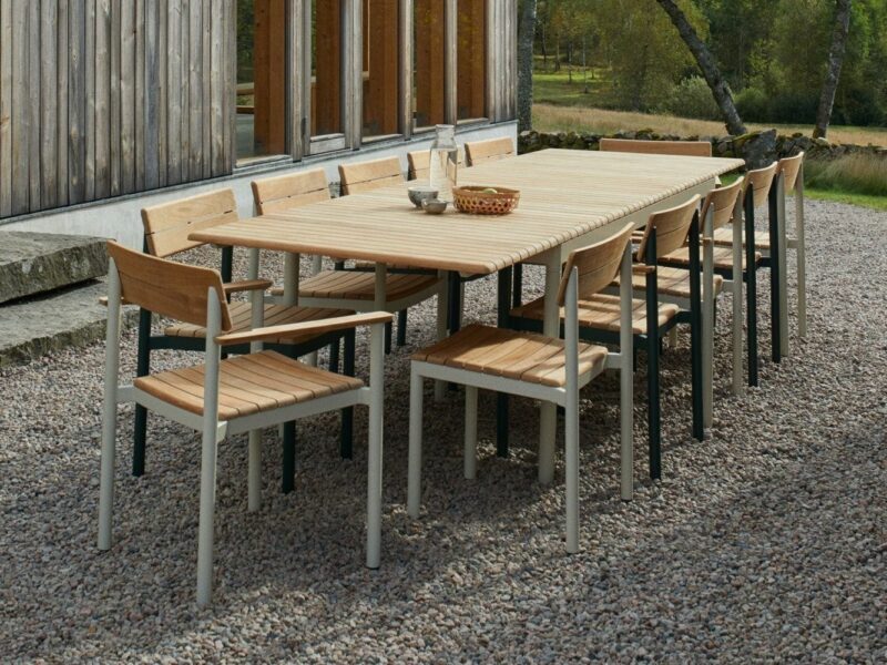 Slatted teak outdoor dining table with metal frame