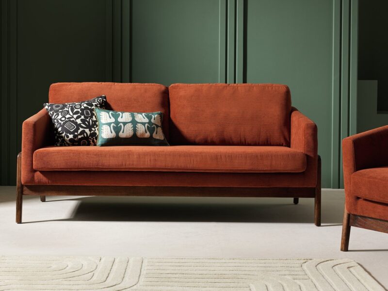 Brown fabric sofa with dark wood frame