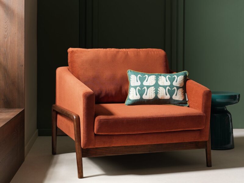 Brown fabric upholstered chair with dark wood frame