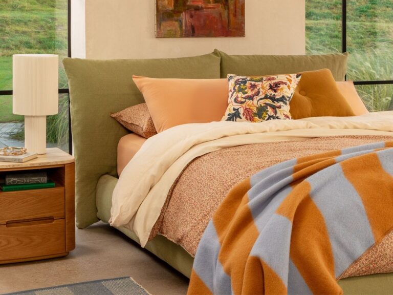 Upholstered bed frame with pillow-style headboard