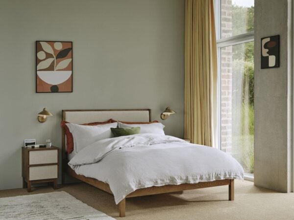 Dark oak bed frame with linen headboard