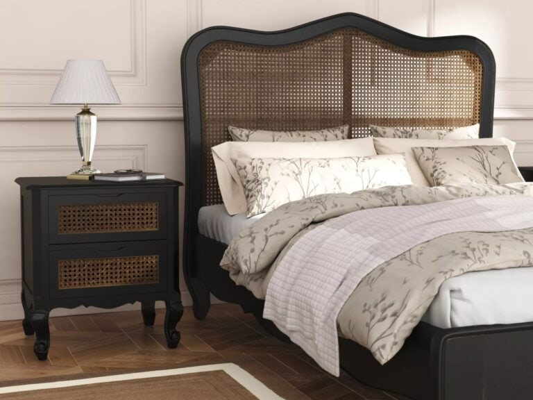 Black-painted bed frame and matching bedside table with rattan panels