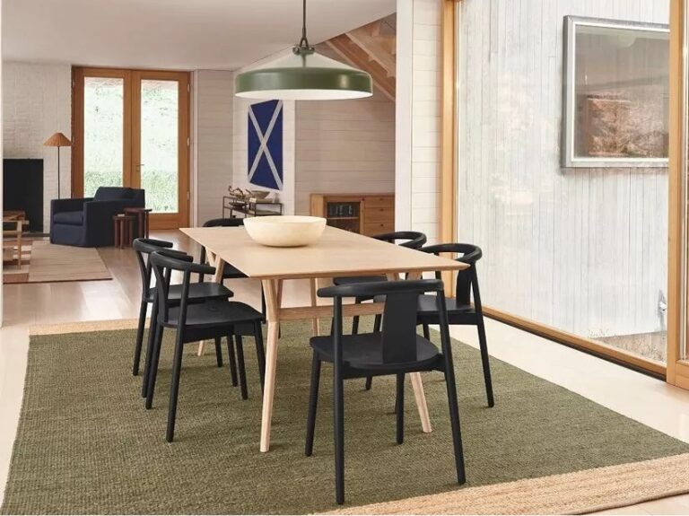 Black-painted dining chairs around an oak table