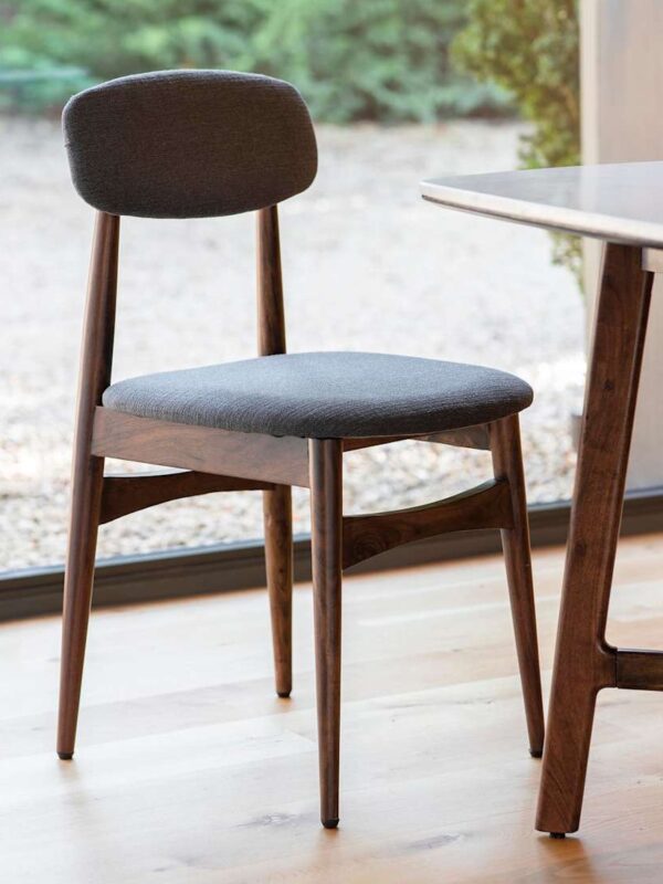 Dark-stained wooden dining chair with grey fabric upholstered seat pad and back rest