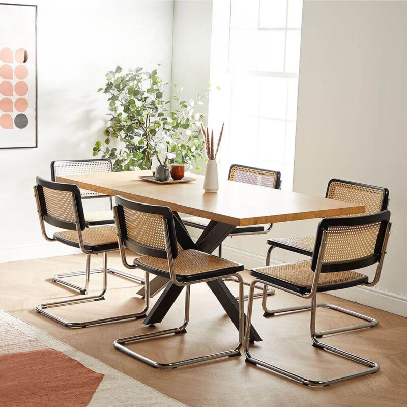 Oak finish rectangular dining table with black cross-leg base