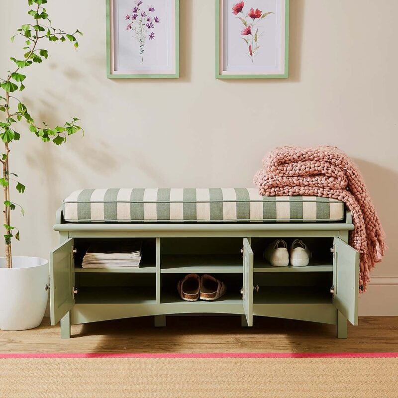 Green storage bench with 3 cupboard spaces, each with a central shelf