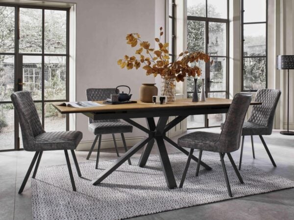 Oak extending dining table with black legs