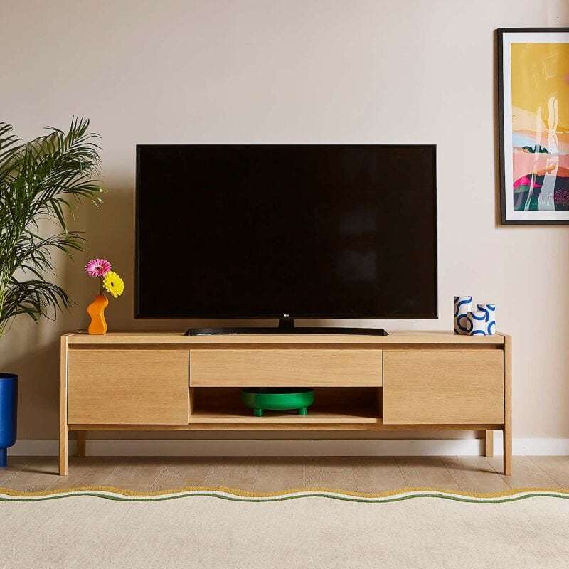 Oak tv unit with two cupboard doors and a single drawer