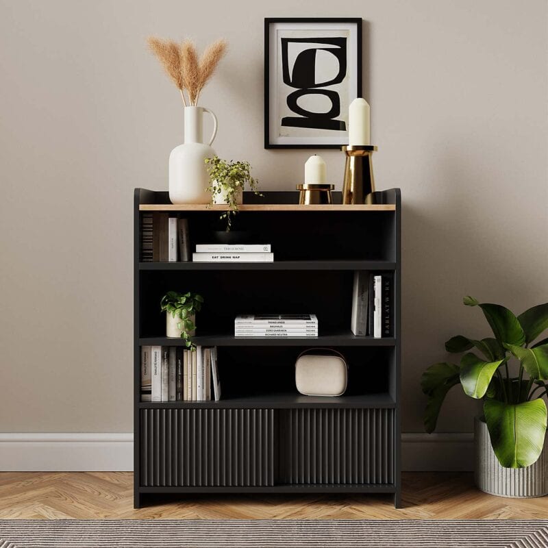 Compact black bookcase with a pair of sliding doors in the base