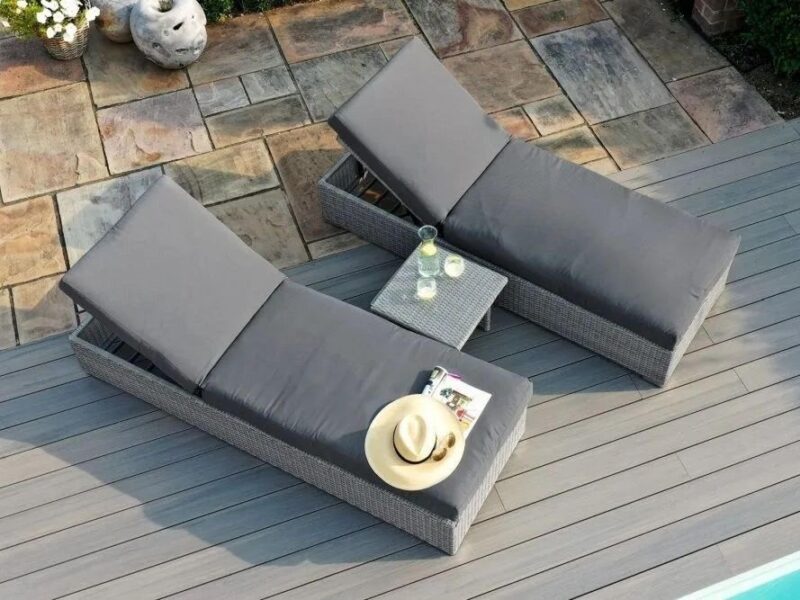 Pair of rattan sun loungers with grey cushions