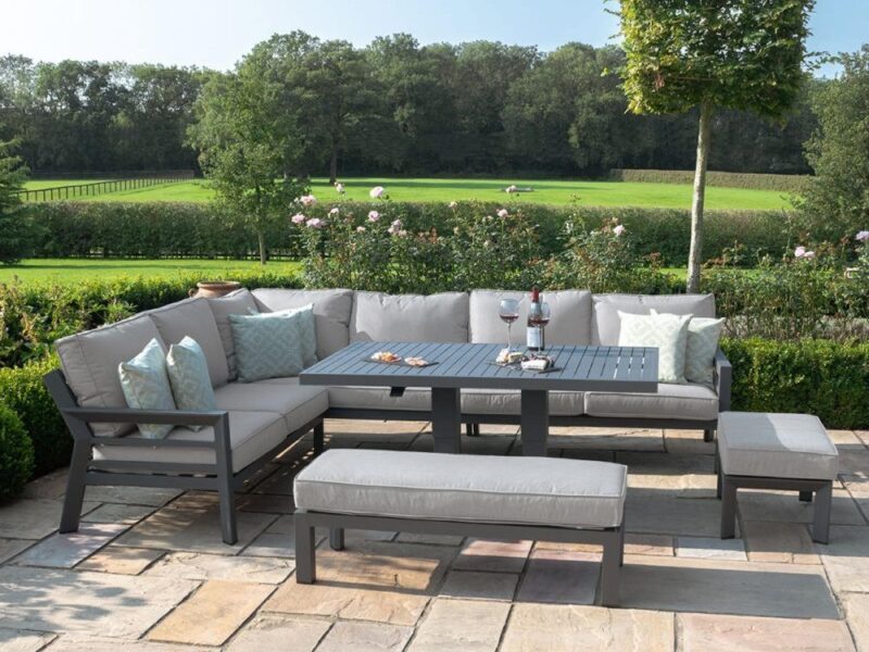 Grey metal outdoor corner sofa and a square grey metal table