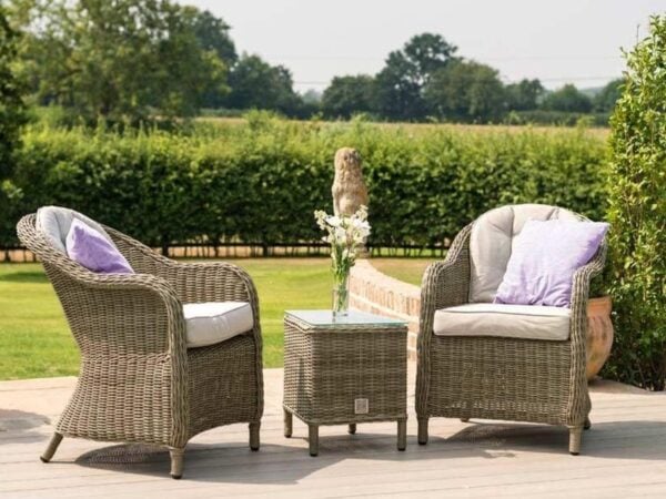 Pair of rattan armchairs and a matching side table